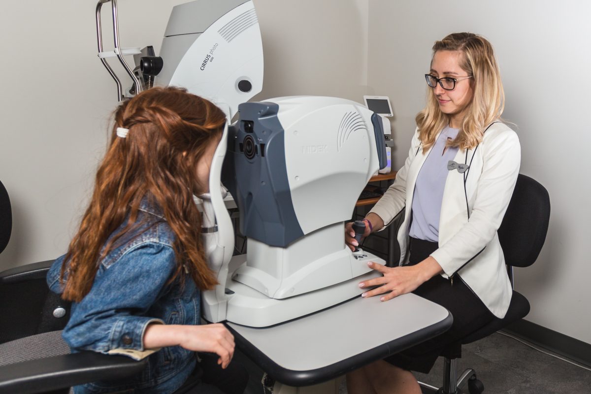 Child getting eye exam pretesting